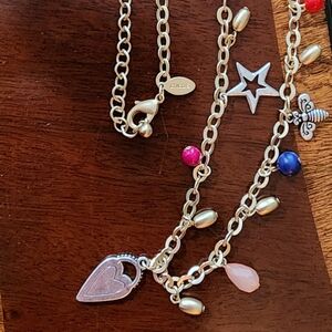 Chicos charm long necklace acrylic and organic stones as charms.